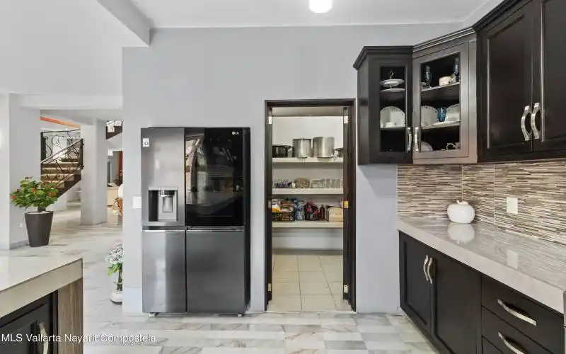 Kitchen and walk-in pantry.