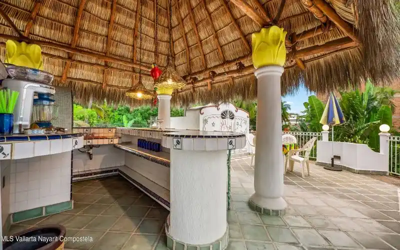 Palapa Bar with Dum Waitor from Kitchen