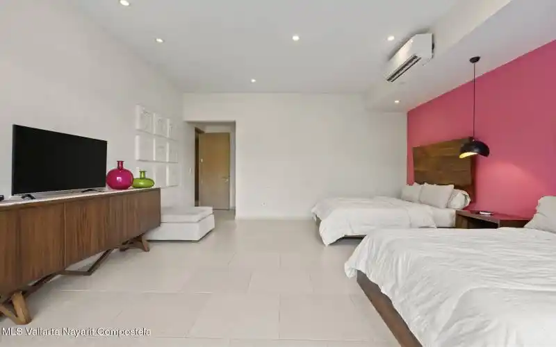 Large bedroom with two beds