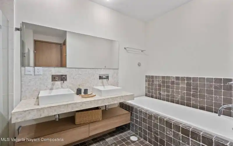 Spacious bathroom with bathtub